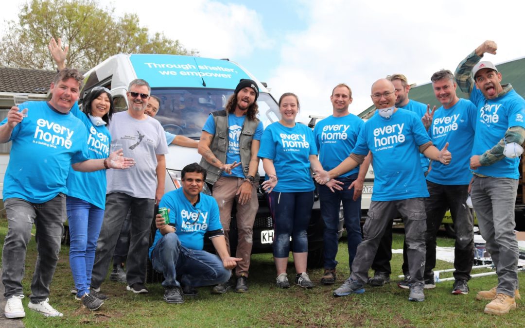 Volunteer team from local business help repair Auckland home