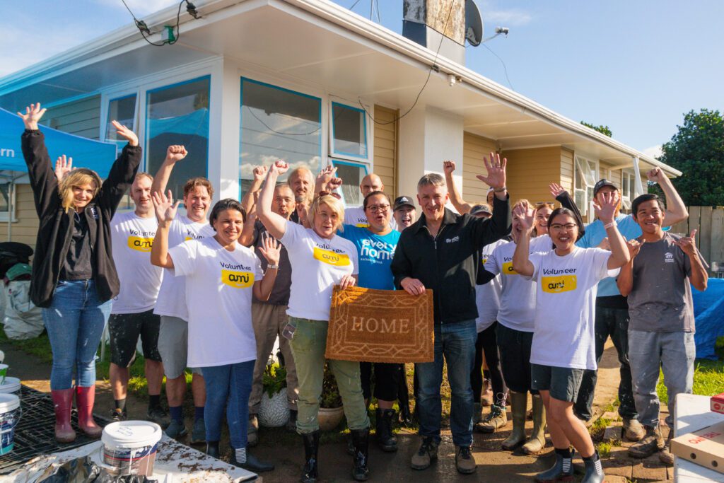 AMI Insurance volunteering with Habitat for Humanity to paint an Otara home. 