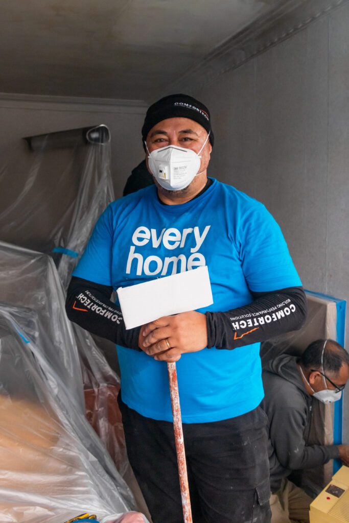 Comfortech volunteers in New Zealand with Habitat for Humanity by painting a house in Auckland.