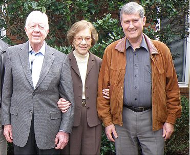 Warren (right) with Jimmy and Rosalyn Carter at the Carters' church in Georgia, USA, January 2009. 