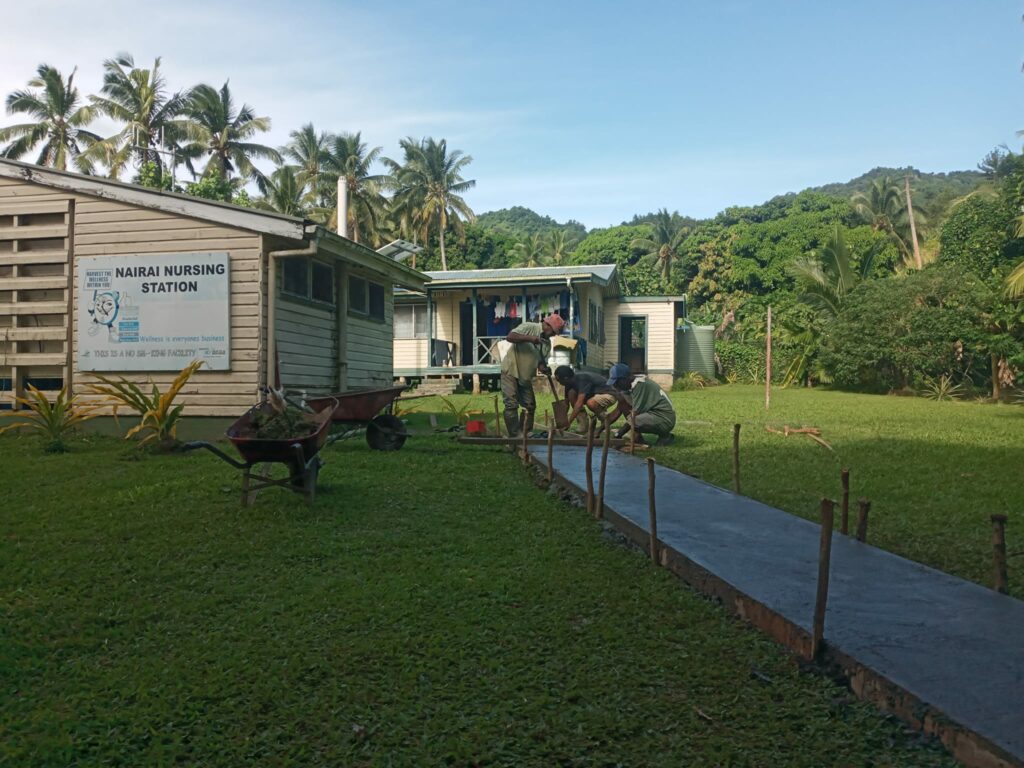 Village in Fiji builds a new concrete footpath supported by Habitat for Humanity New Zelaand. 